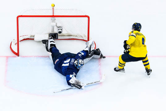 Axel Sandin-Pellikka of Sweden and Goaltender Noa Vali of