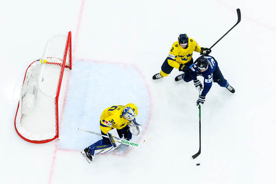 goaltender Melker Thelin and Elias Pettersson of Sweden