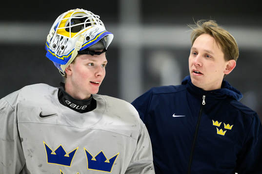 goaltender Melker Thelin and goaltender coach Viktor Alm of