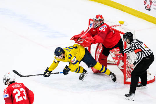 Jonathan Lekkerimäki of Sweden and goaltender Alessio