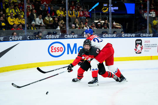 Macklin Celebrini of Canada and Jakub Stancl of Czech