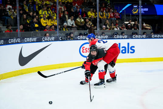 Macklin Celebrini of Canada and Jakub Stancl of Czech