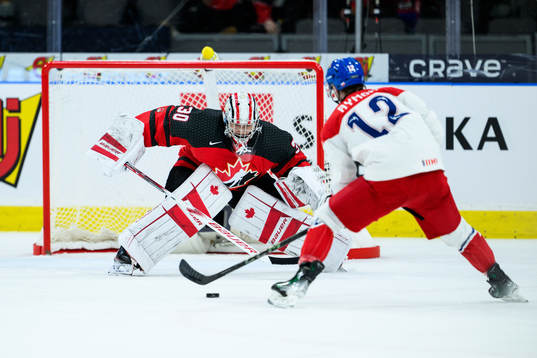 goalkeeper Mathis Rousseau of Canada and Dominik Rymon of