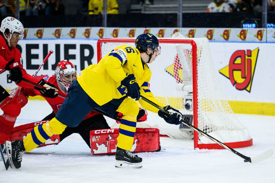 David Edstrom of Sweden and goaltender Alessio Beglieri of