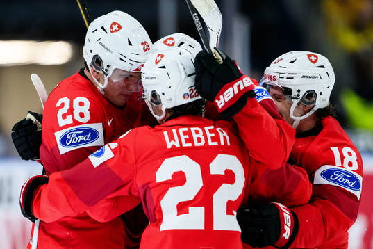 Nick Meile of Switzerland celebrates with  team mates