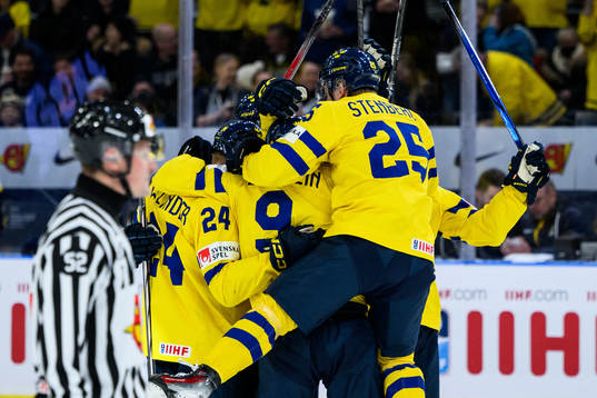 Players of Sweden celebrate with Theo Lindstein