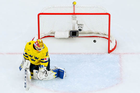 Goaltender Hugo Hävelid of Sweden looks dejected