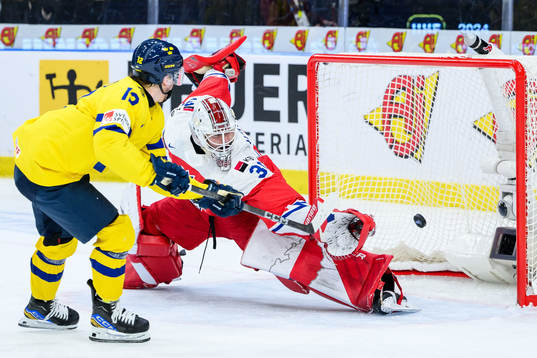 Noah Östlund of Sweden scores the 5-2 goal behind