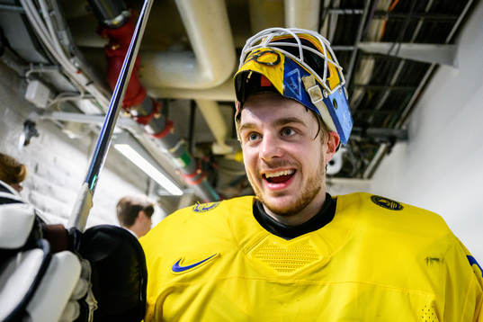 Goaltender Hugo Hävelid of Sweden celebrates