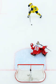 Noah Östlund of Sweden against goaltender Michael Hrabal