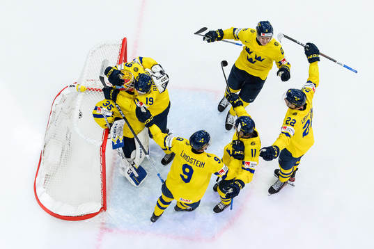 goaltender Hugo Hävelid of Sweden celebrate ith teammates
