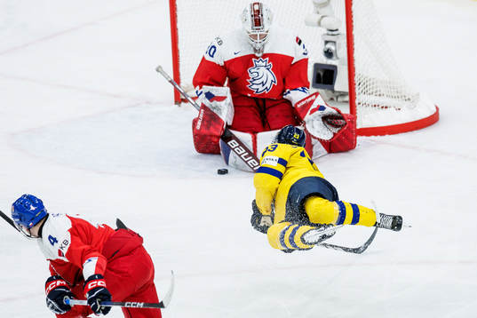 Jonathan Lekkerimäki of Sweden and goaltender Michael