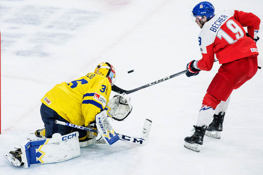 Goaltender Hugo Hävelid of Sweden and Ondrej Becher of