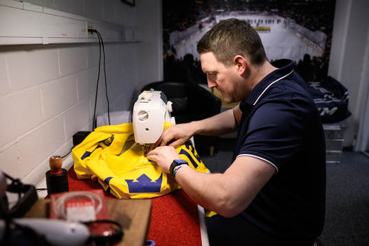 Equipment manager Daniel Nilsson of Sweden preparing a