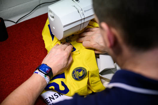 Equipment manager Daniel Nilsson of Sweden preparing a