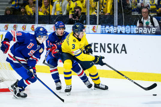 Lane Hutson and Ryan Chesley of USA against Elias