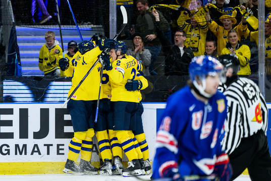 Players of Sweden celebrate with Otto Stenberg