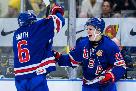Will Smith and Zeev Buium of USA celebrate the 4-2 goal