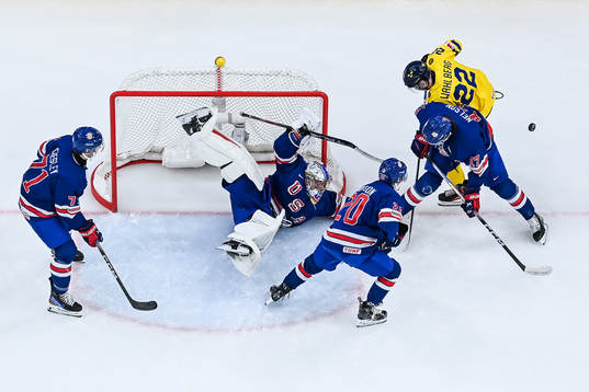 Anton Wahlberg of Sweden against Ryan Chesley, goaltender