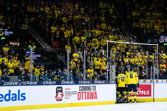 Noah Östlund and Anton Johansson of Sweden leave the ice