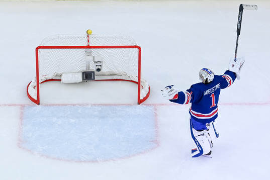 Goaltender Trey Augustine of USA celebrates