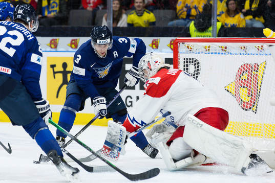 Otto Salin of Finland and goaltender Jakub Vondras of Czech