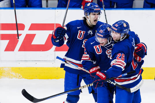 Cutter Gauthier and Seamus Casey celebrate with Isaac Howard