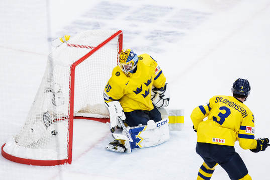 Goaltender Hugo Hävelid of Sweden looks dejected
