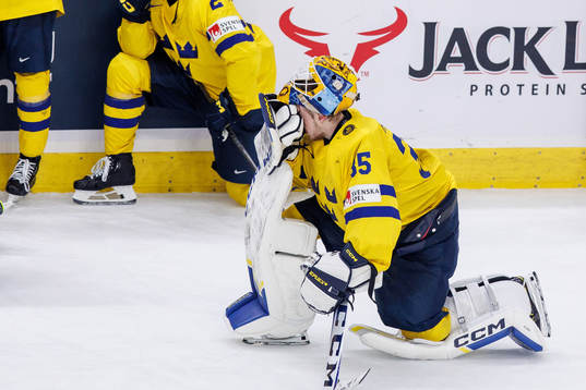 Goaltender Hugo Hävelid of Sweden looks dejected