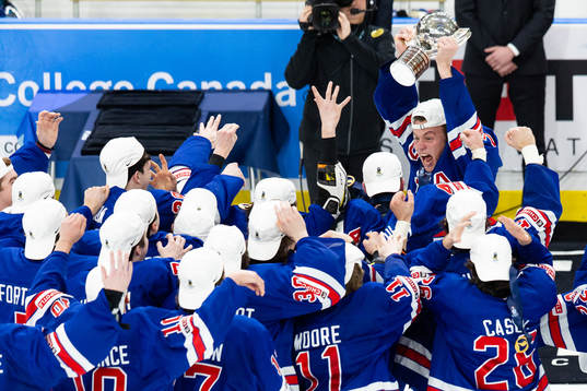 Rutger McGroarty of USA lifts the trophy