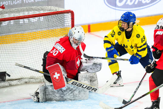 Mira Hallin of Sweden scores 4-0 behind goaltender Talina
