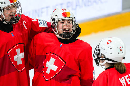 Elisa Dalessi of Switzerland celebrates with teammates