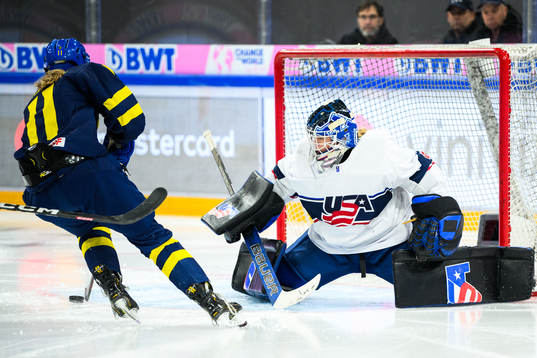 Ella Hellman of Sweden and goaltender Layla Hemp of USA