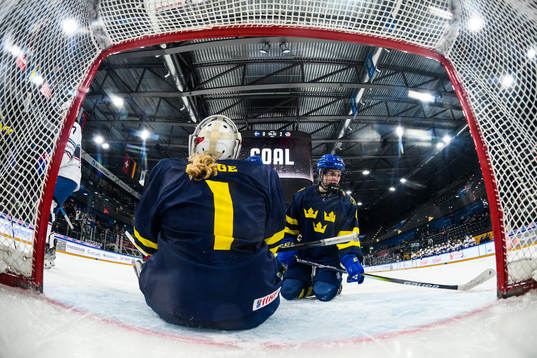 Goaltender Maja Helge and Nellie Svensson of Sweden look