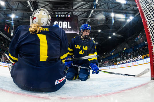 Goaltender Maja Helge and Nellie Svensson of Sweden look