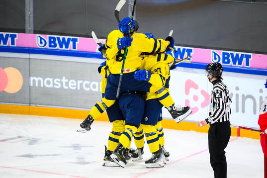 Ella Hellman of Sweden (not in picture) celebrates with