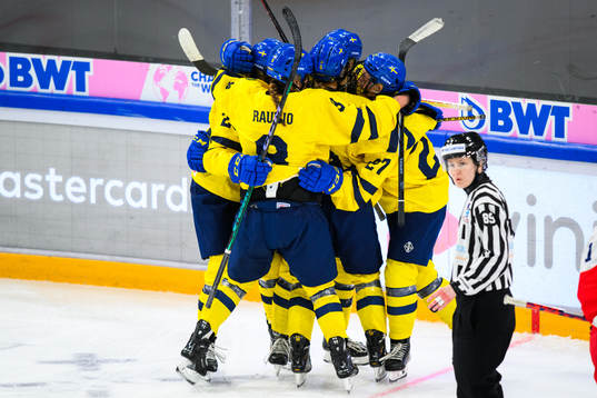 Ella Hellman of Sweden (not in picture) celebrates with