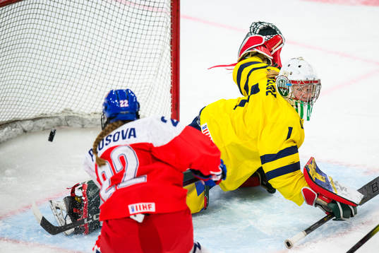 Tereza Plosova of Czechia scores 2-3 behind goaltender Maja