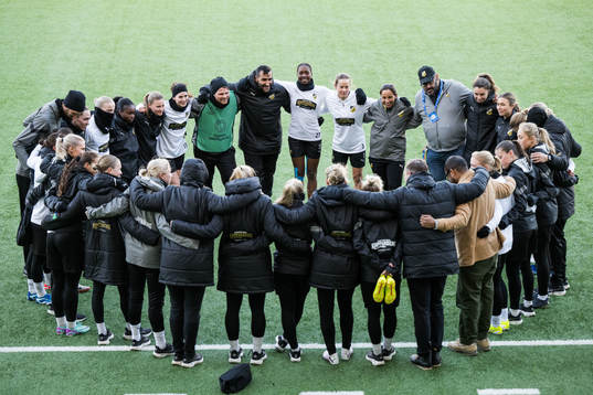 The team gather