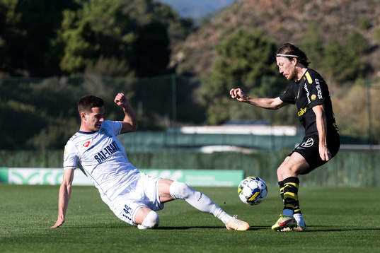 Vukasin Krstic of FK TSC Backa Topola and Axel Björnström