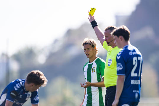 Markus Karlsson of Hammarby receives a yellow card