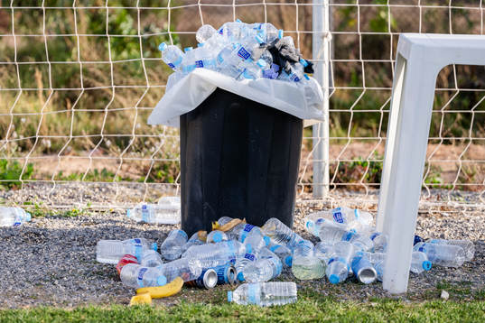 Waterbottles in a trash can