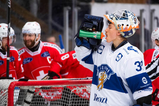 Goalkeeper Emil Larmi of Finland looks dejected during the