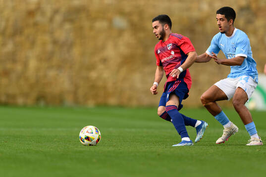 Mads Westergren of Dallas and Zakaria Loukili of Malmö FF