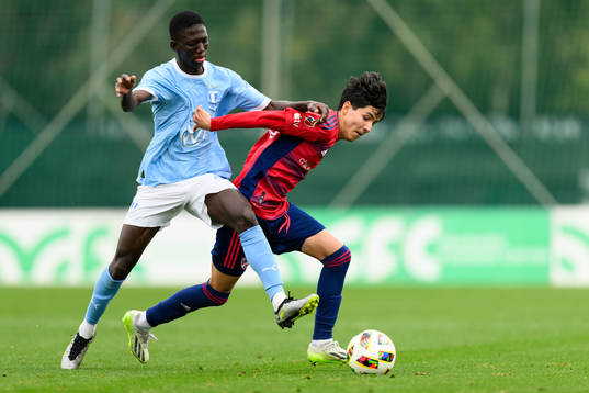 Mamadou Diagne of Malmö FF and Alejandro Urzua of Dallas
