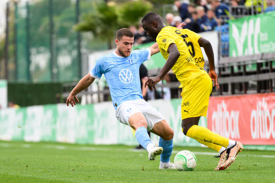 Gabriel Busanello of Malmö FF and Brice Wembangomo of