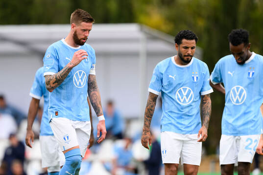 Pontus Jansson and Sergio Pena of Malmö FF looks dejected