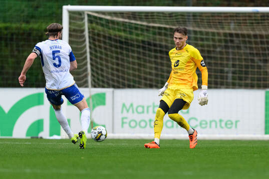 Christoffer Nyman of IFK Norrköping and Goalkeeper Martin