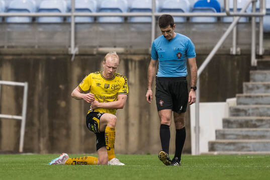 André Boman of Elfsborg and Referee Fabio Loureiro
