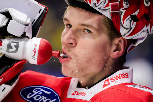 goaltender Connor Hughes of Switzerland ahead the Beijer